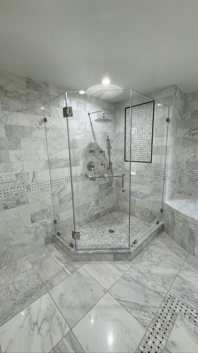 Frameless neo-angle shower enclosure with chrome hardware