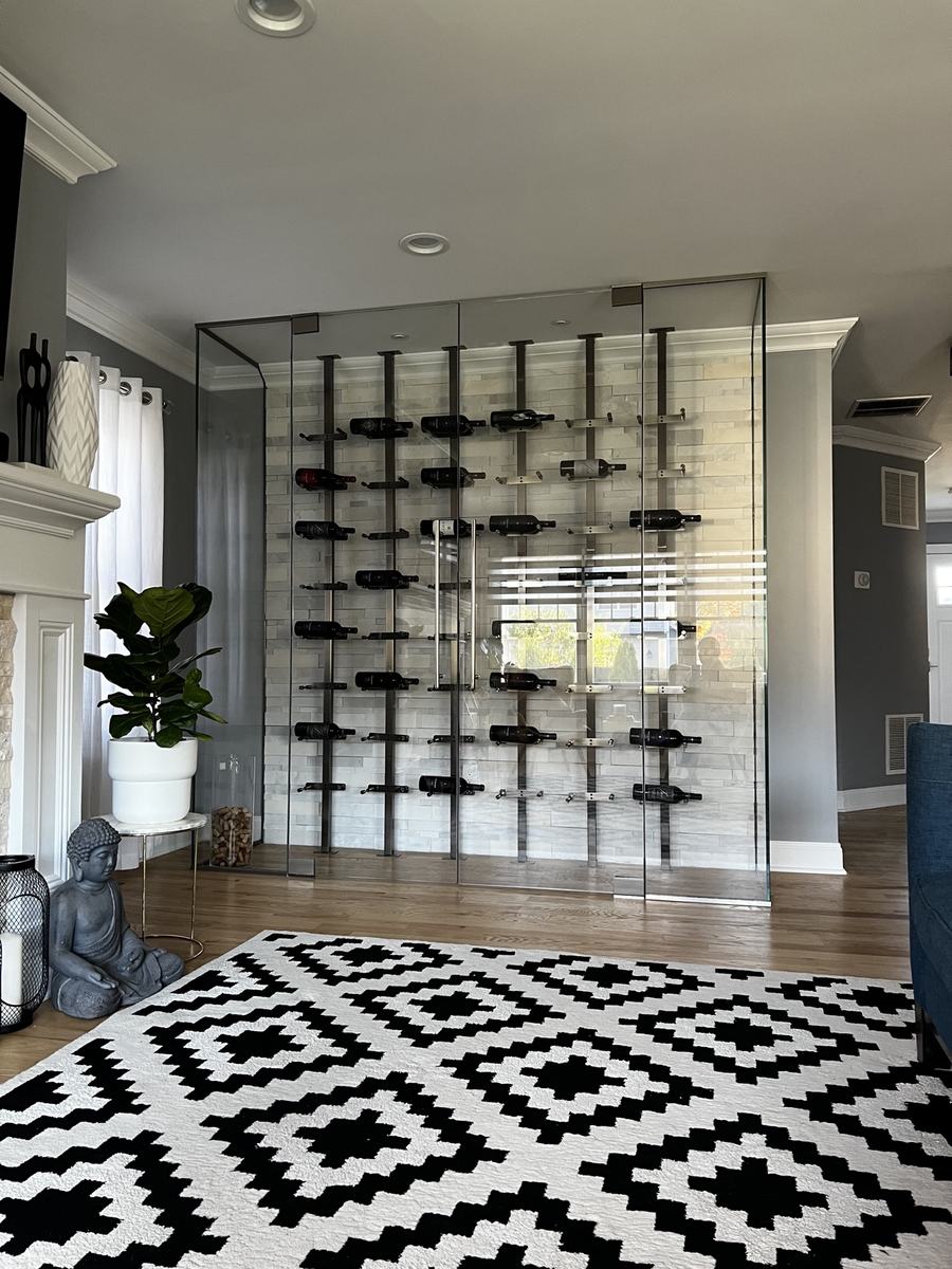 Frameless glass wine wall with metal racking